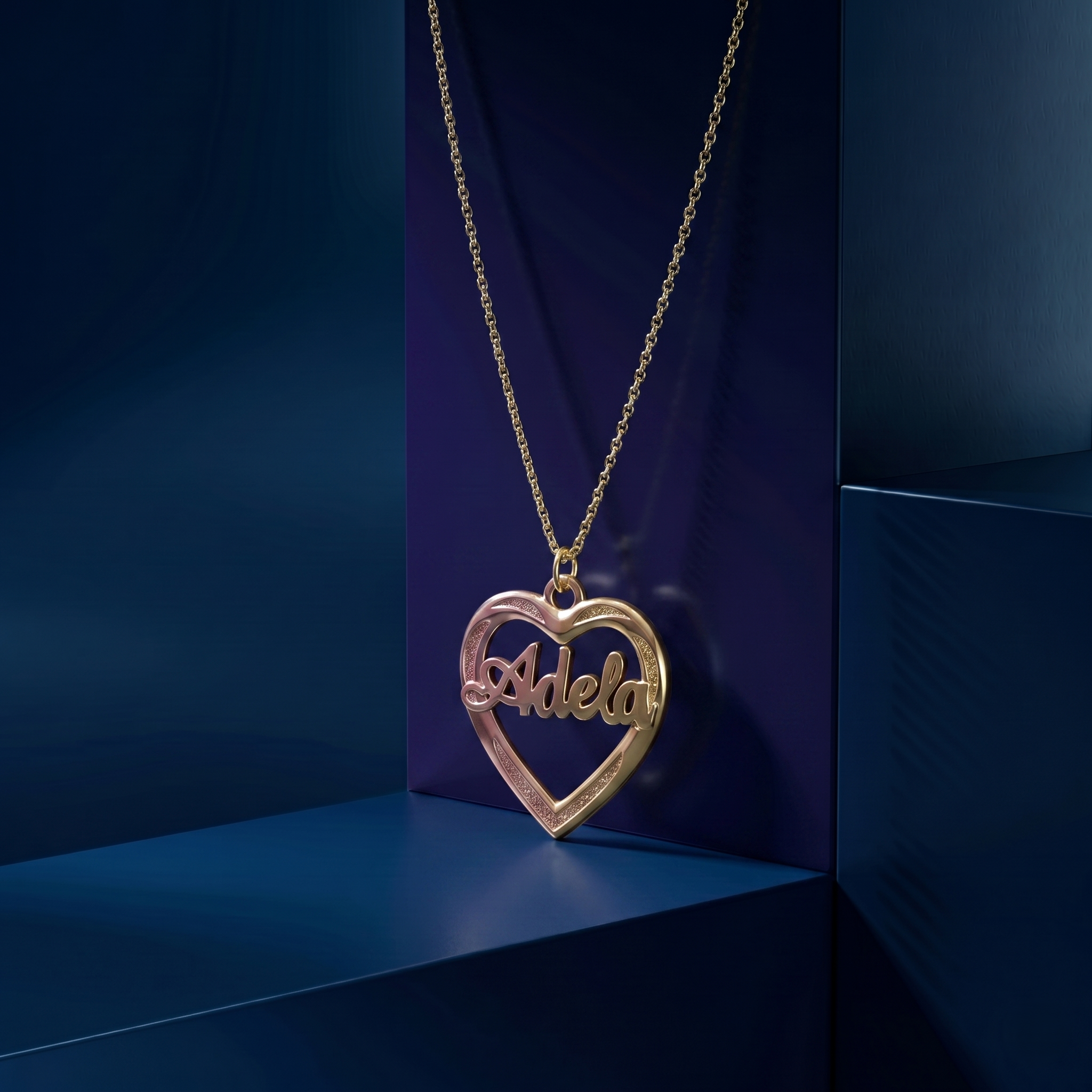 Luxury custom name necklace in 14k and 18k gold, featuring a handcrafted 3D nameplate inside a heart design, premium personalized jewelry made in Los Angeles by master jewelers