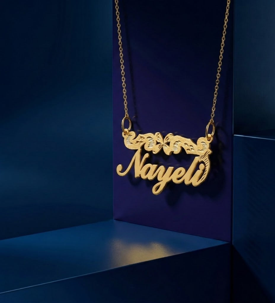 Elegant gold nameplate pendant with signature diamond-cut accents, created as a meaningful luxury gift with refined handcrafted jewelry detailing.