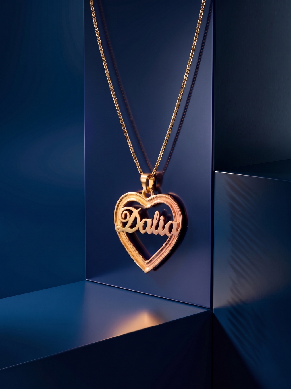 Luxury personalized heart necklace with sculpted name lettering, crafted in warm multi-gold tones and designed as a high-end bespoke jewelry piece with elegant depth and shine