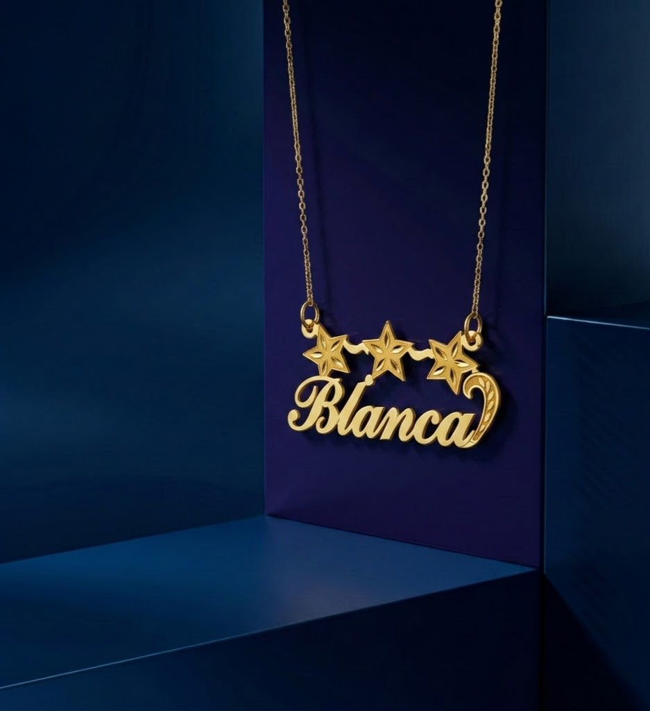 Handcrafted gold name necklace with three star accents, signature CustomGolds INC jewelry featuring elegant script font and professional high-end polished finish