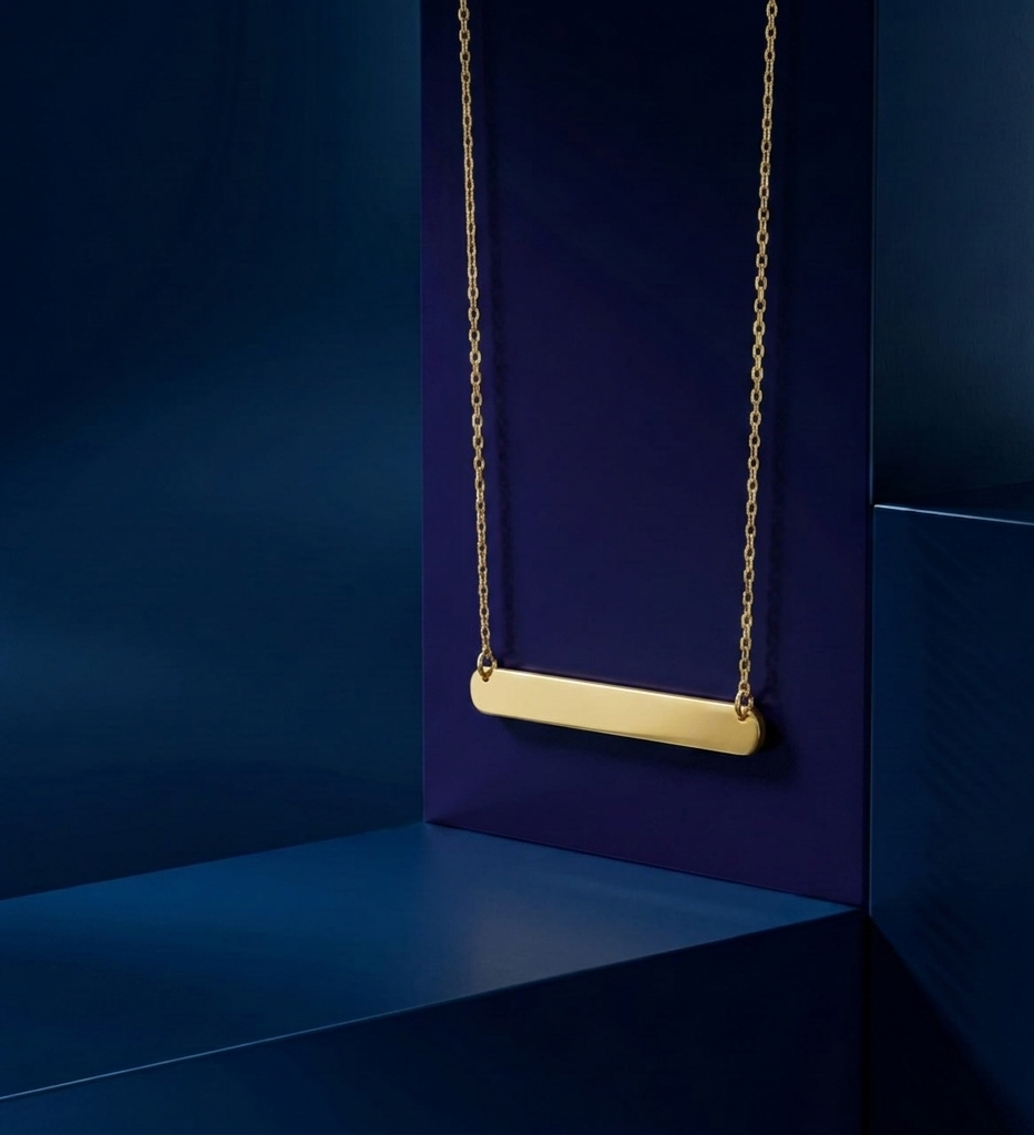 Handcrafted personalized gold accessory featuring engraved nameplate on a luxury pendant, elegant fine jewelry with yellow gold finish by CustomGolds INC.