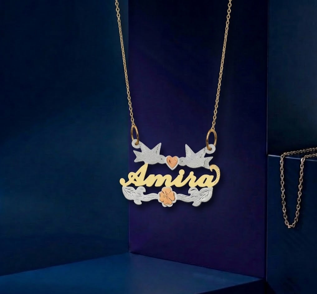 Tri-tone gold nameplate pendant with a poetic composition of doves and floral elements, a handcrafted bespoke jewelry piece finished with a high-end mirror polish.