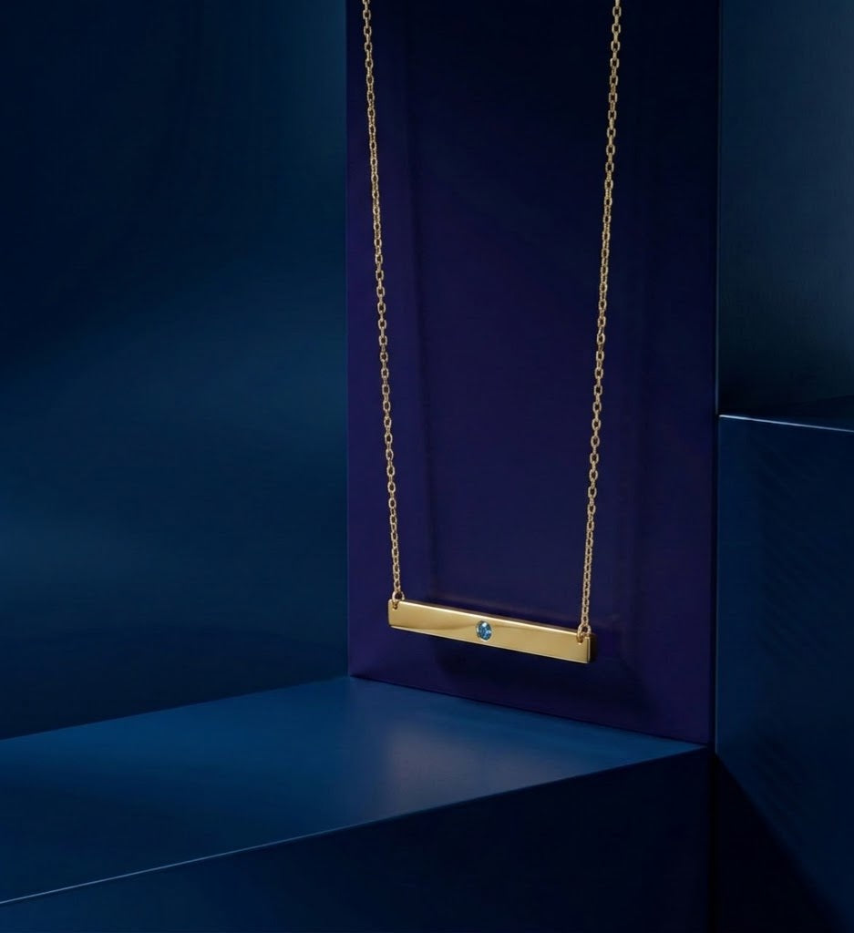 Handcrafted nameplate pendant style – Minimalist Gold Bar Necklace with Blue Gemstone Accent, customizable custom name necklace with custom gold lettering in yellow gold custom jewelry