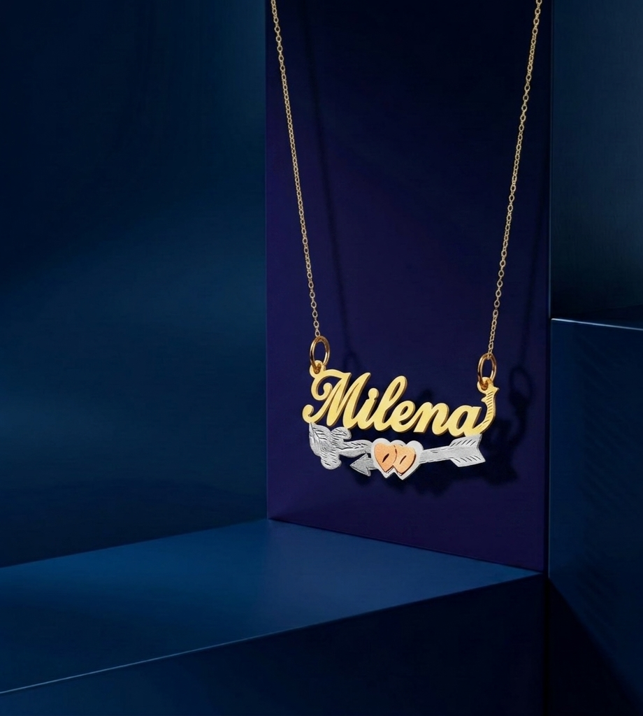 Customized gold accessory featuring romantic heart and arrow details, polished nameplate pendant lettering, handcrafted fine jewelry craftsmanship, and elegant layered style for everyday luxury wear.