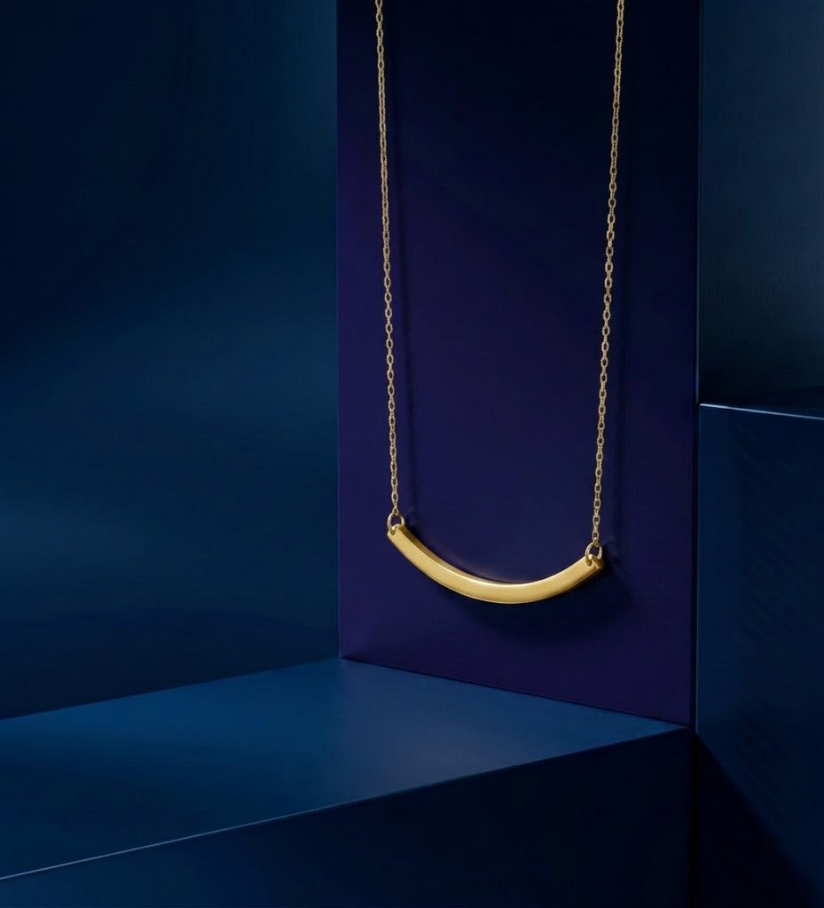 Minimalist curved custom nameplate necklace crafted in 18K solid gold and sterling silver, featuring personalized gold lettering and handcrafted luxury finish by CustomGolds INC.