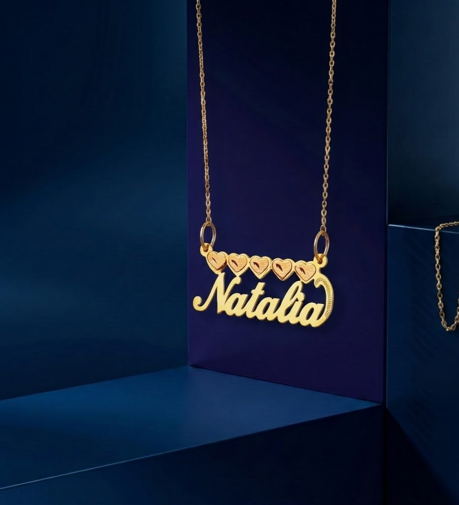 Bespoke heart nameplate pendant necklace in premium gold, featuring flowing script lettering, soft satin texture, and a timeless everyday luxury jewelry design.