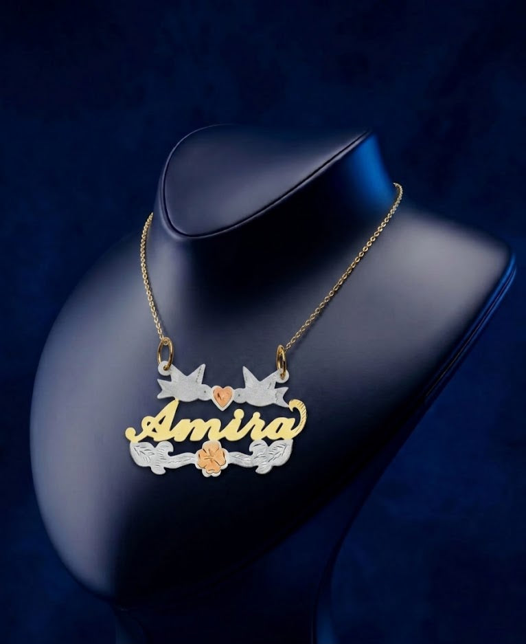 Custom nameplate necklace by CustomGolds INC in tri-color gold, inspired by symbols of peace and blooming florals, fully handcrafted as a refined luxury statement piece.