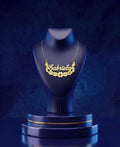 Custom floral nameplate necklace with radiant gemstone accent, crafted in 14k gold and sterling silver, featuring fine engraving and luxury jewelry design by CustomGolds INC with a high-polish professional finish.