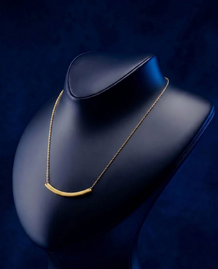 Luxury custom name necklace with curved nameplate pendant, handcrafted fine jewelry in 14k–18k gold inspired by modern Los Angeles style from CustomGolds INC.