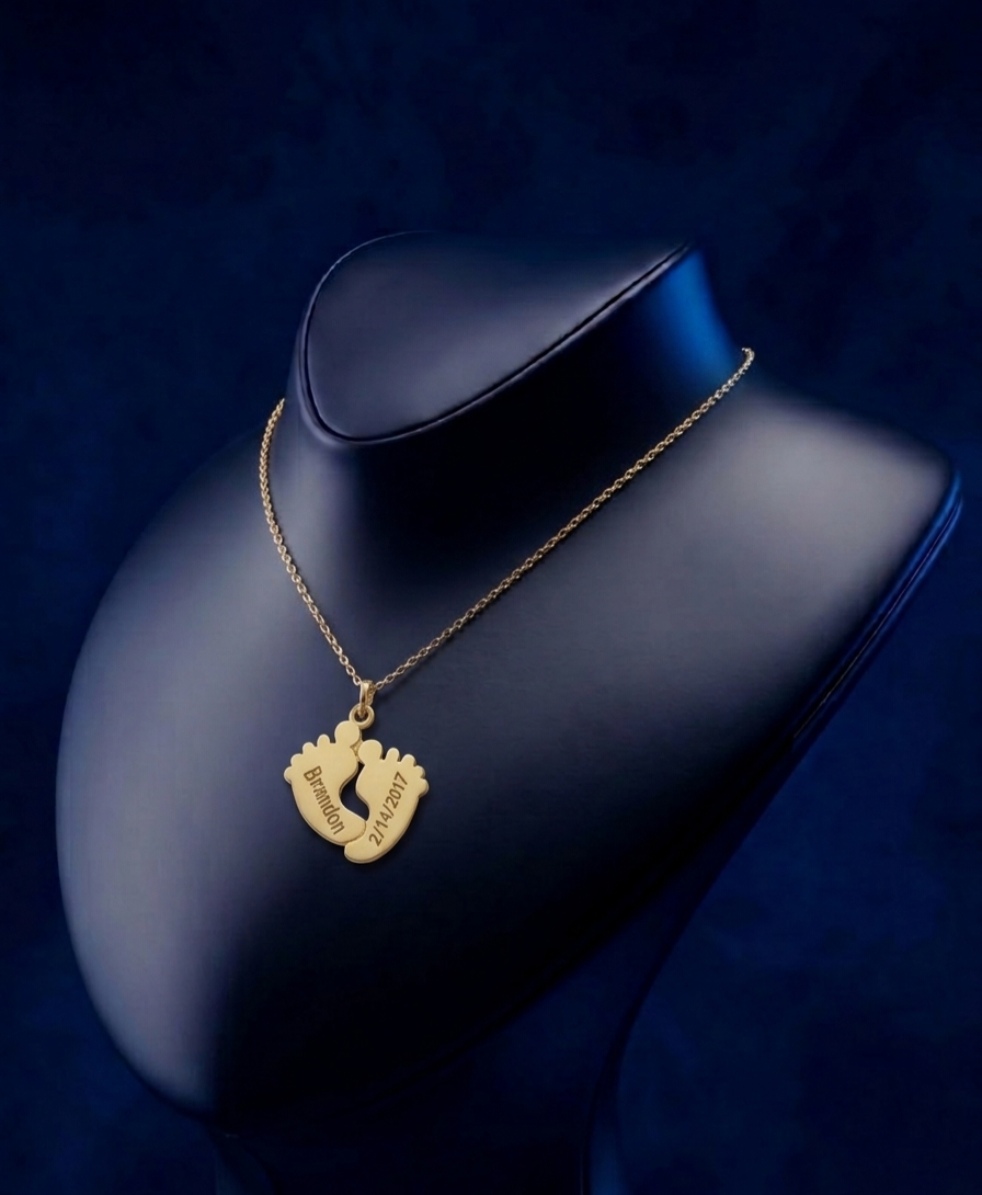 Master jeweler handcrafted script name necklace with tiny baby footprints, luxury custom design in high-polish yellow gold finish, Los Angeles fine jewelry by CustomGolds INC