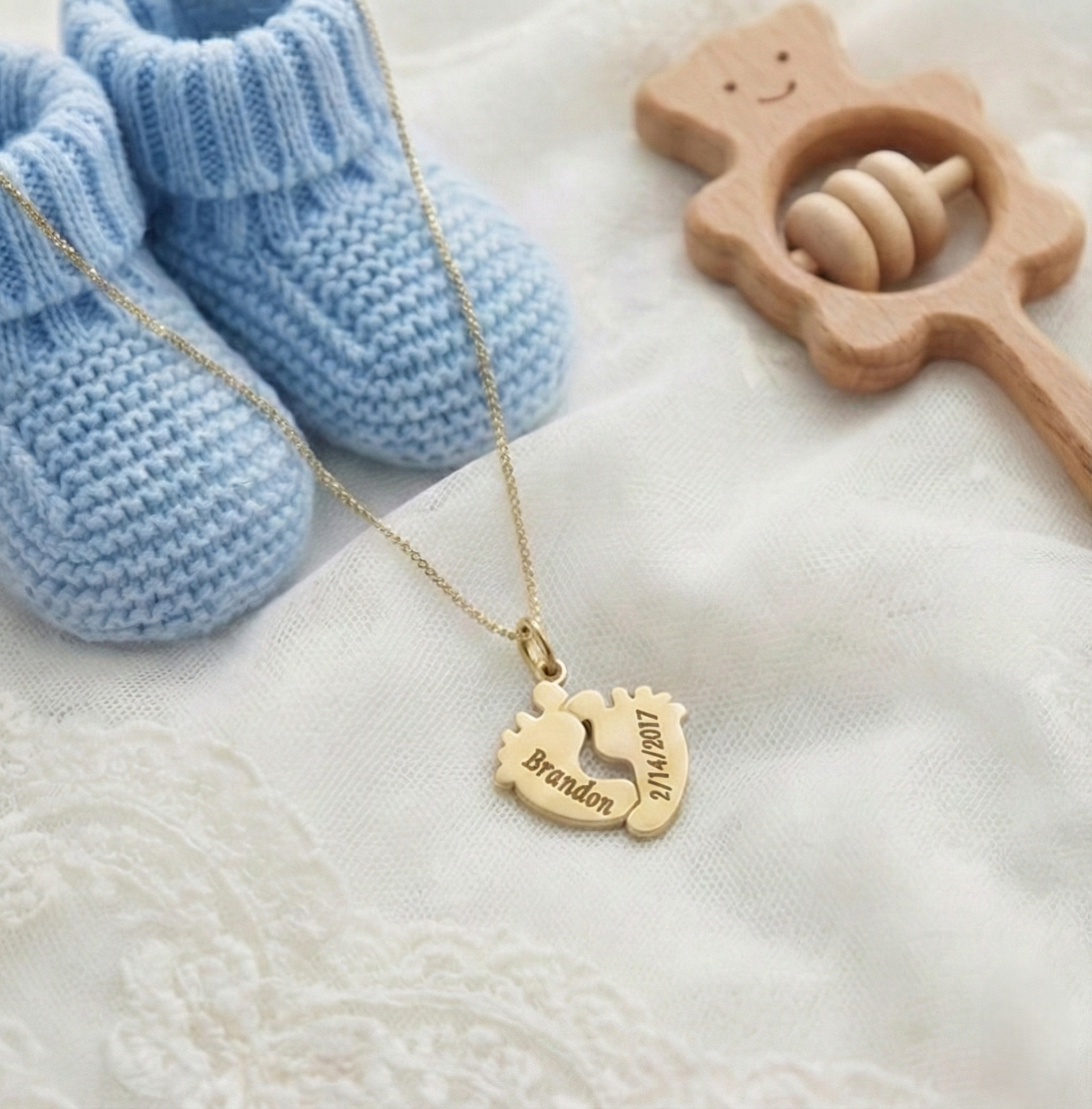Custom engraved baby footprints necklace with name and date in gold vermeil over sterling silver