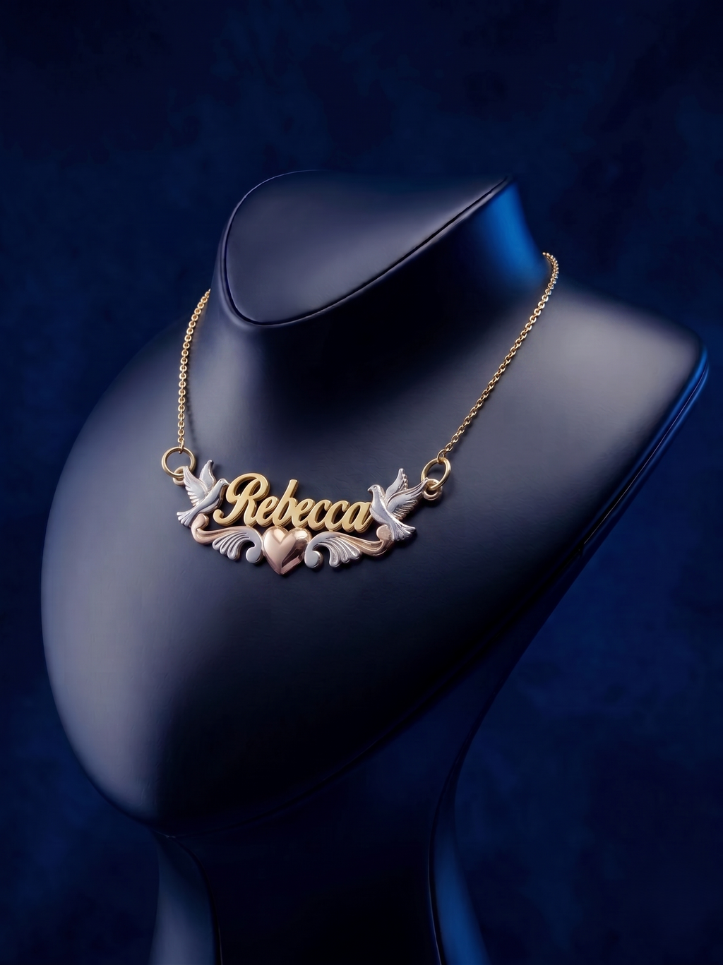 Personalized gold nameplate necklace with script lettering, crafted in yellow 18k solid gold, designed as a bespoke fine jewelry piece with soft satin and polished accents.