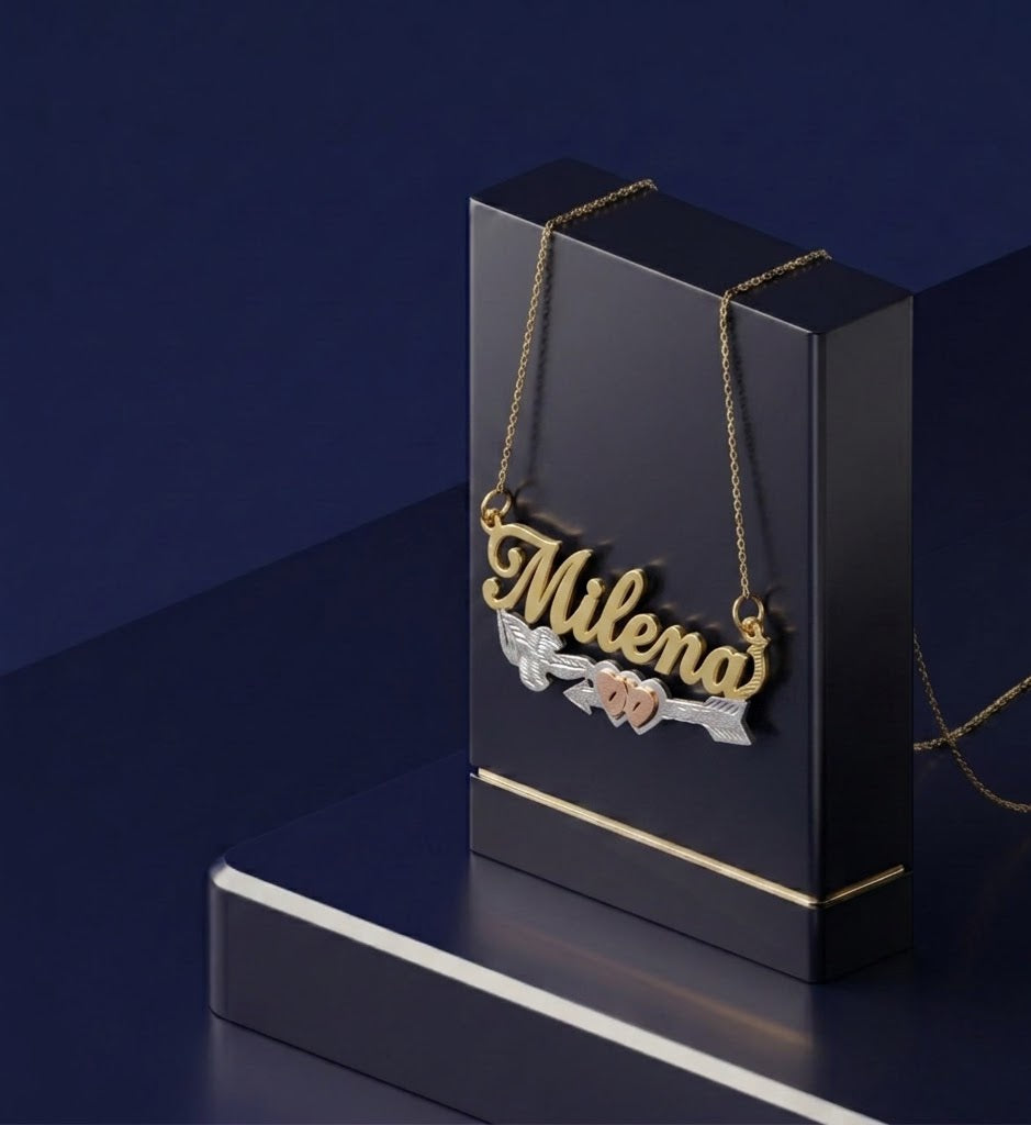 Fine jewelry custom gold name necklace with romantic hearts and arrow motif, master jeweler handcrafted in Los Angeles using premium personalized jewelry techniques and elegant yellow gold styling.