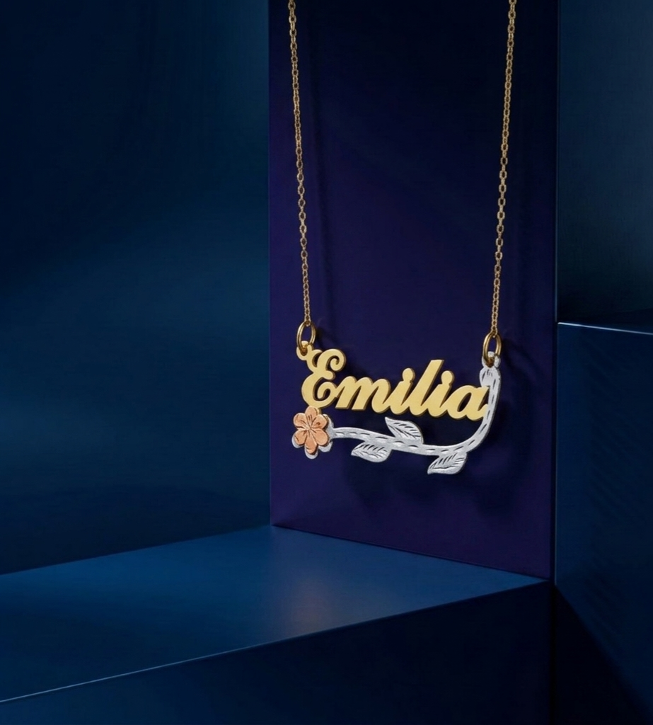 Bespoke tri-color custom name necklace in fine jewelry gold tones, script name pendant with botanical floral and leaf detailing, premium luxury personalized gift piece
