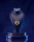 Elegant two-tone floral heart nameplate necklace in 14k–18k gold, featuring a custom script nameplate with a high-polish luxury finish by CustomGolds INC.
