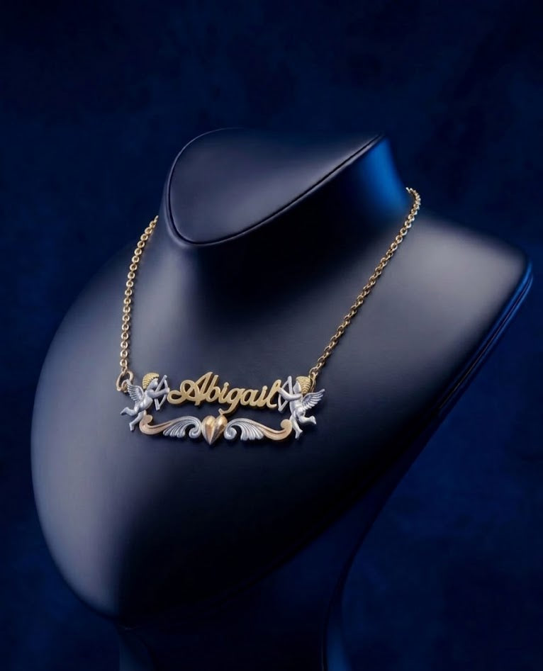 Custom 3D script name necklace with Cupid angel and heart motif in multi-tone gold, premium bespoke jewelry piece crafted in 18k solid gold style, designed by master jewelers for elegant personalized wear.