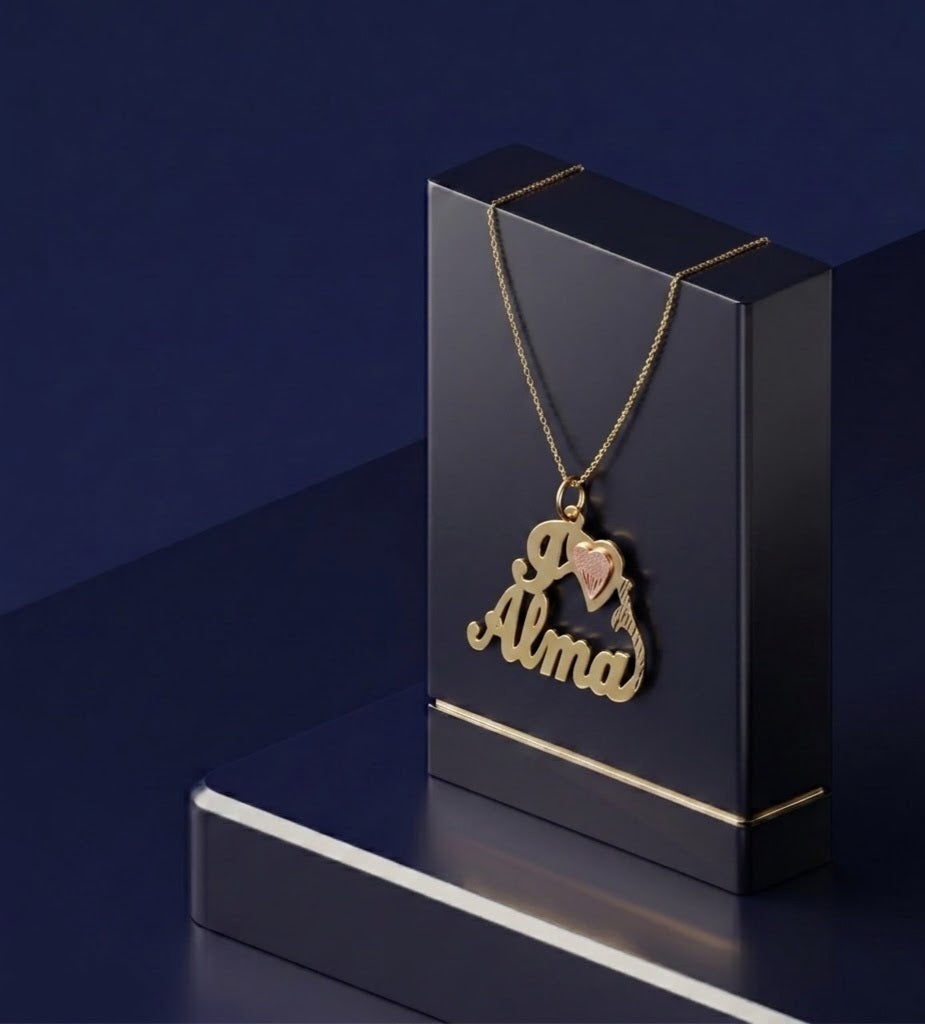 Elegant custom heart nameplate necklace in mixed gold and sterling silver tones, featuring delicate script lettering, soft satin-polish texture, and refined artisan detailing.