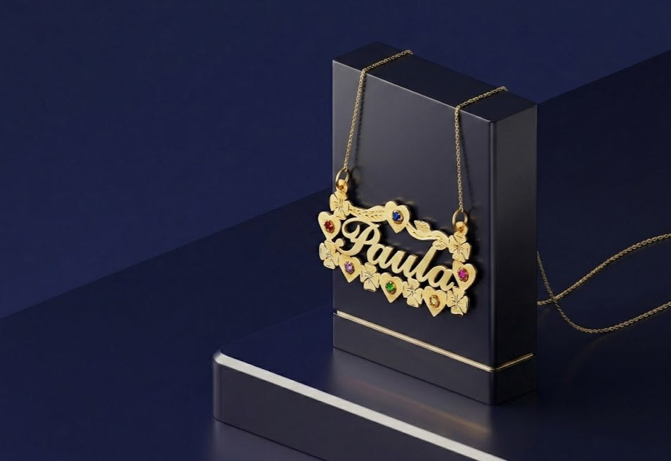 Bespoke gold nameplate necklace with floral heart design, custom script lettering and gemstone accents, premium personalized jewelry piece by CustomGolds INC with signature handcrafted detailing