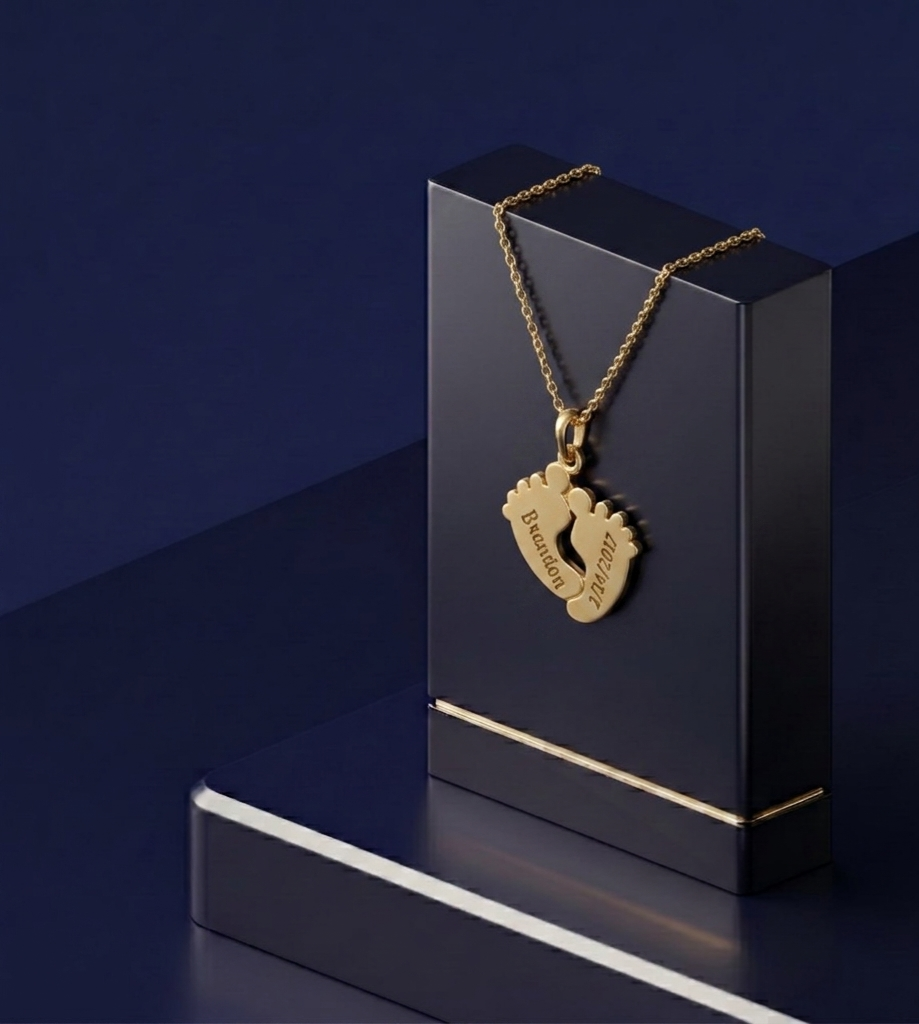 Bespoke jewelry piece – personalized baby footprints pendant on sterling silver base with soft-polish satin finish and premium personalized gold lettering by CustomGolds INC