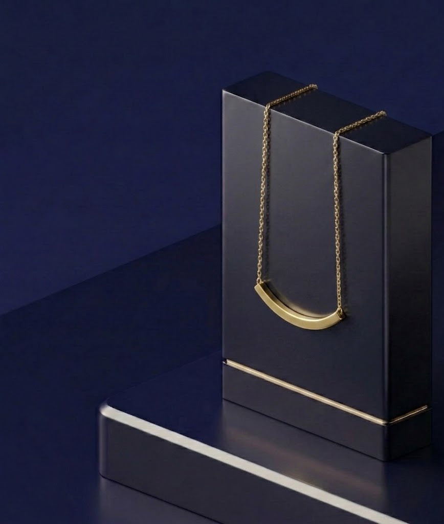 Elegant curved script name necklace with premium personalized nameplate design, soft satin polish, and bespoke yellow gold craftsmanship by CustomGolds INC.