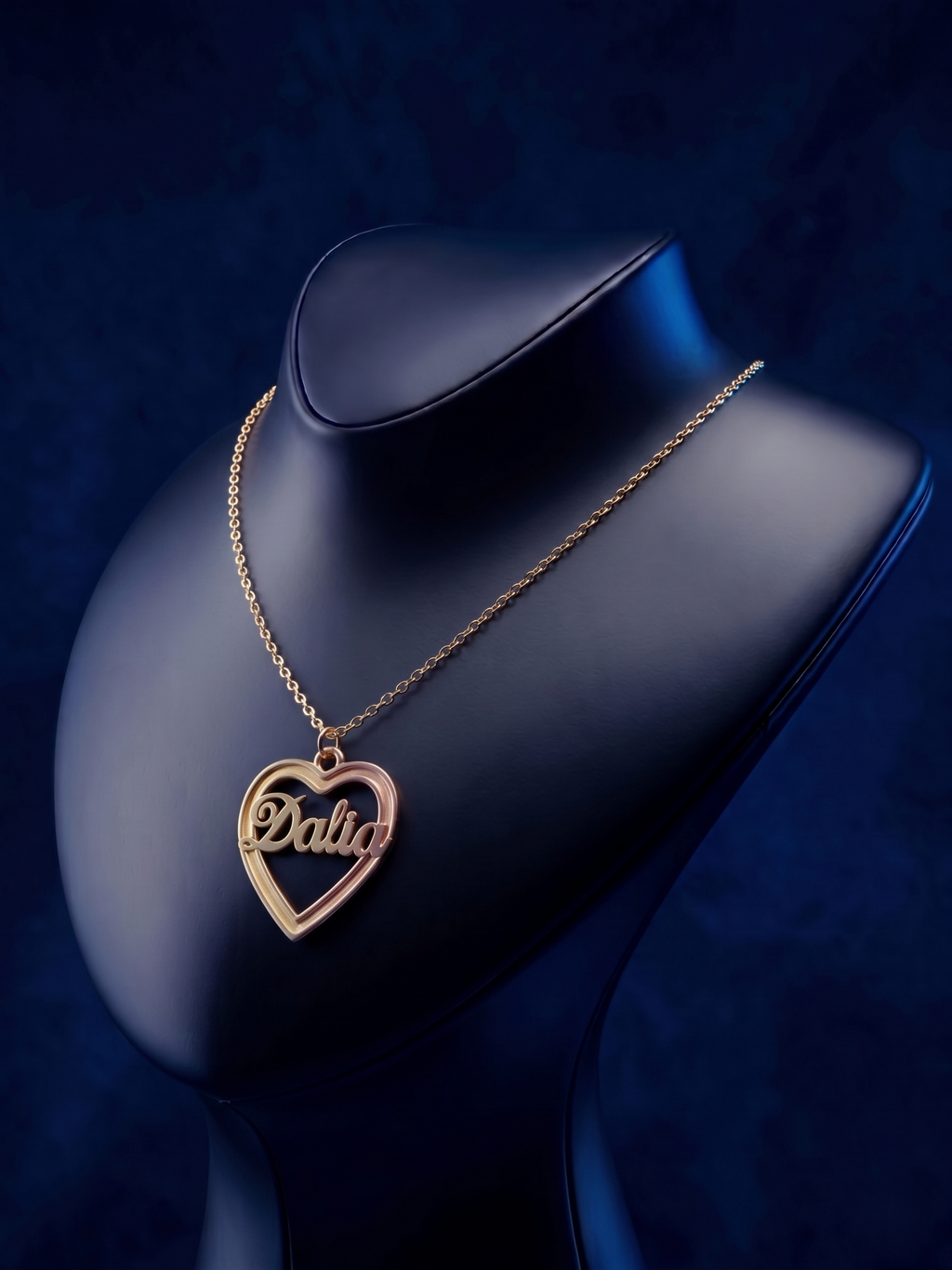 Bespoke multi-tone gold necklace with a heart outline and dimensional name design, offering a luxury handcrafted finish and a modern personalized script style