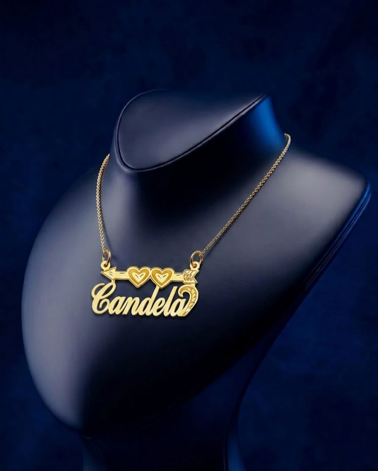 Bespoke custom name pendant in gold with Cupid arrow passing through two hearts, premium personalized jewelry piece with refined script-style detailing and artisan craftsmanship