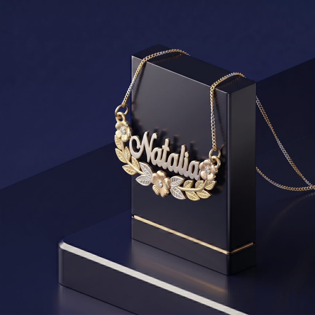 Luxury bespoke jewelry piece with raised custom gold lettering, dimensional floral detailing, and a soft-polish satin finish for a refined look
 