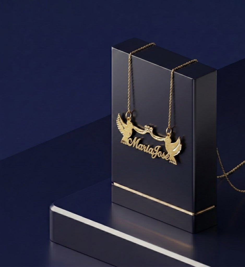 Fine yellow gold custom jewelry piece with double dove elements and feminine bow design, styled as a modern personalized nameplate with premium detailing by CustomGolds INC
