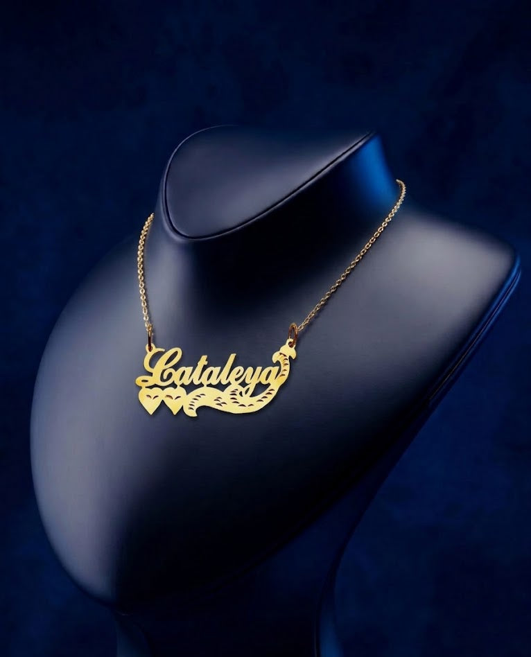 Handcrafted gold pendant with personalized script nameplate, polished yellow gold shine, and luxury custom design created as a fine jewelry statement accessory by CustomGolds INC
