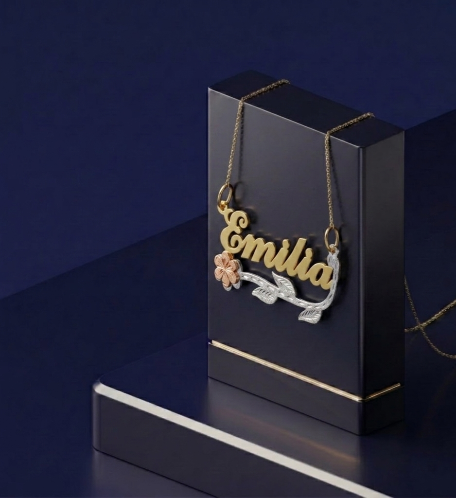 Elegant personalized nameplate necklace with custom gold lettering, featuring floral and leaf motifs, soft satin polish, and signature handcrafted design from CustomGolds INC