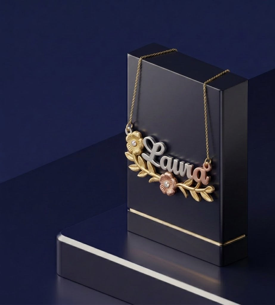 Designer personalized nameplate necklace with multi-tone gold tones, script-style custom name pendant, high-end handcrafted jewelry with floral-inspired details