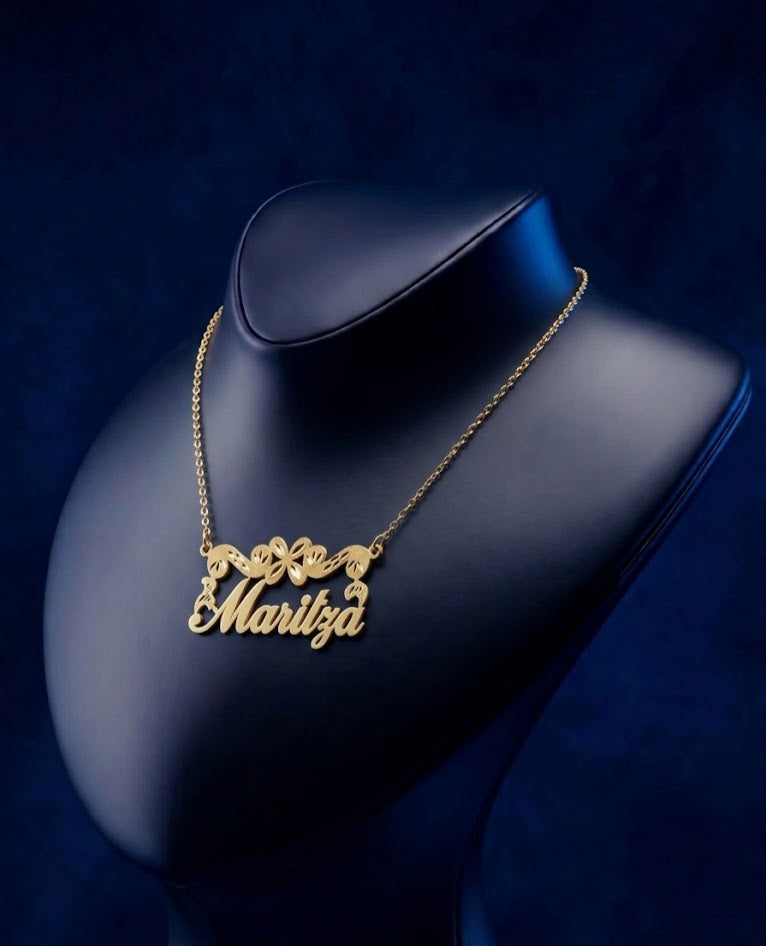 Custom 14k gold nameplate necklace with floral scroll design and diamond-cut details, handcrafted luxury jewelry designed by CustomGolds INC