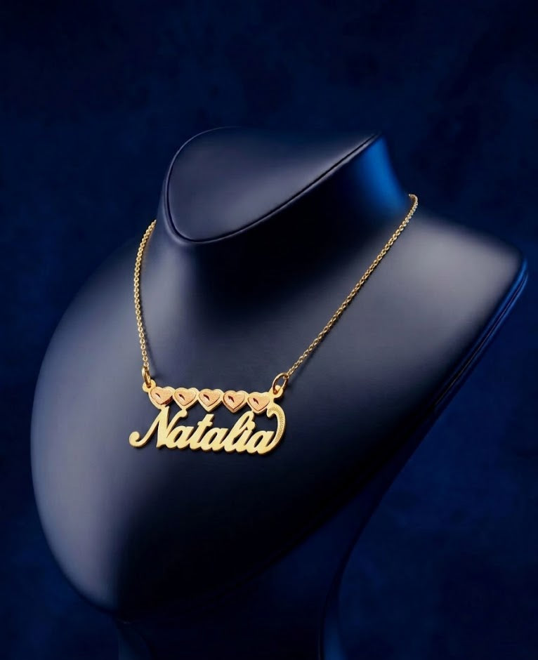 Luxury heart-shaped name pendant in 14k and 18k gold tones, designed with minimalist elegance, high-polish brilliance, and crafted in a premium Los Angeles jewelry studio.