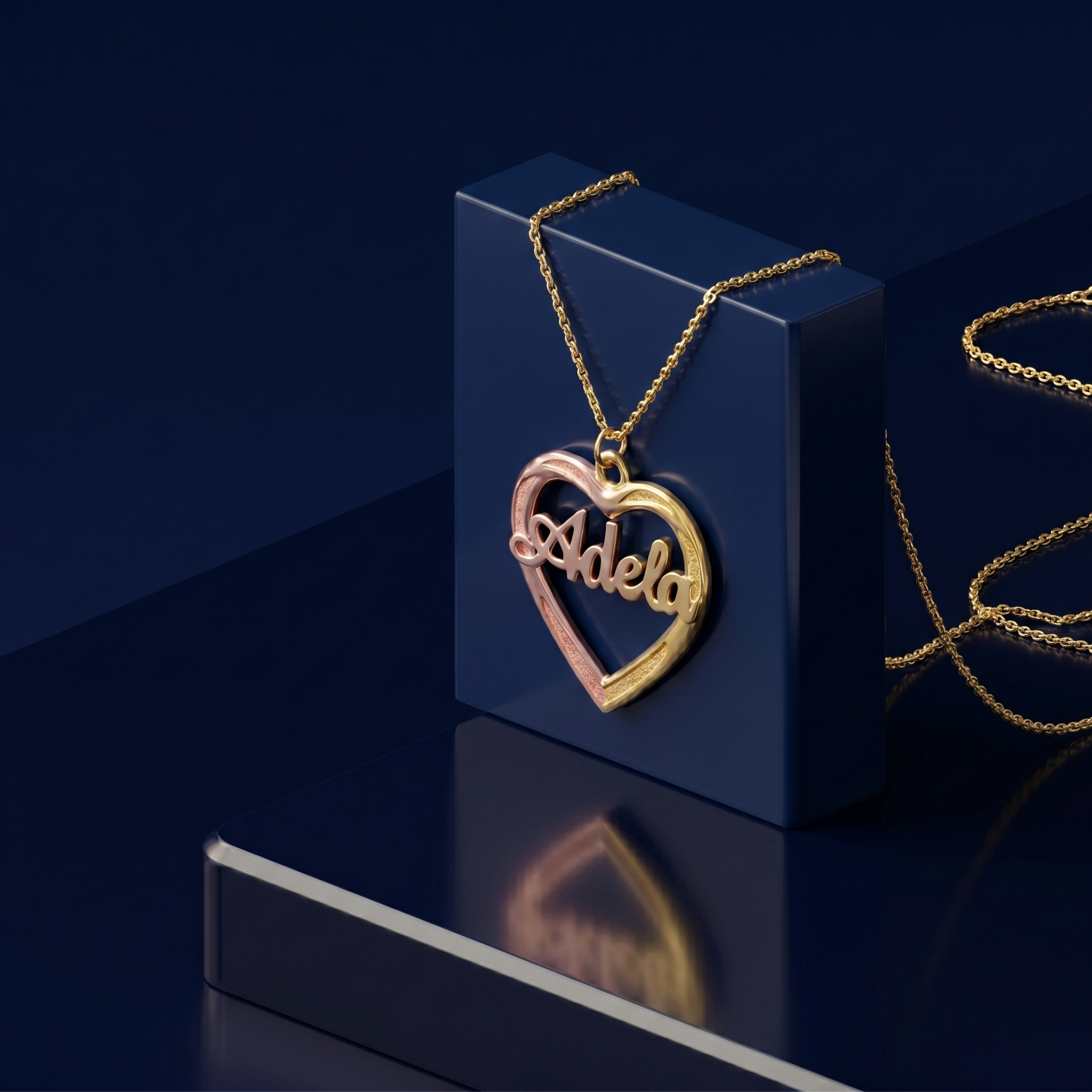 Personalized gold name necklace with 3D lettering inside a multi-tone heart pendant, bespoke fine jewelry from CustomGolds INC, handcrafted luxury gift with satin and high-polish detailing.